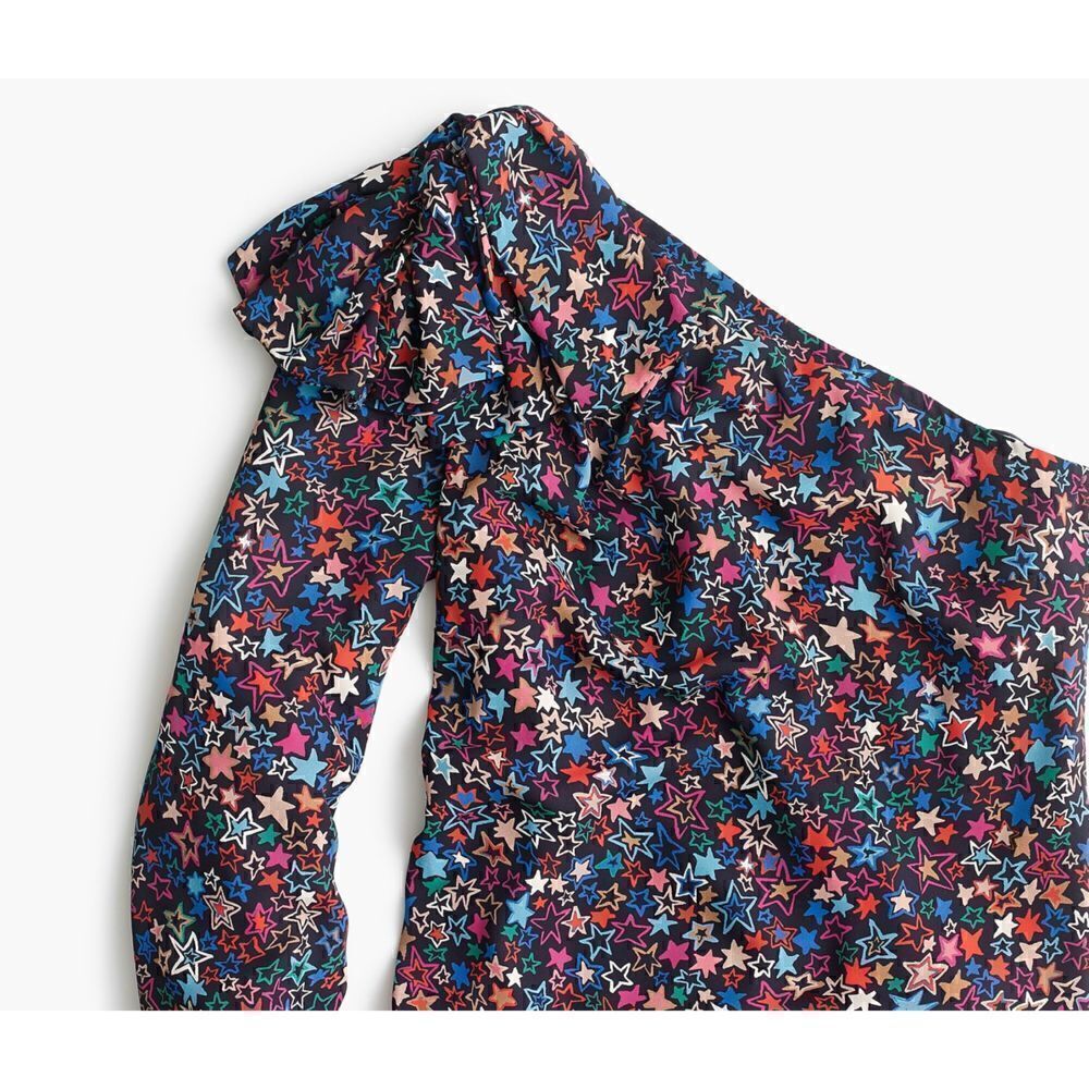 NWOT One-shoulder top in kaleidoscope star print size 10